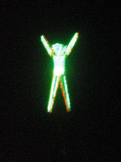 The man raises his arms